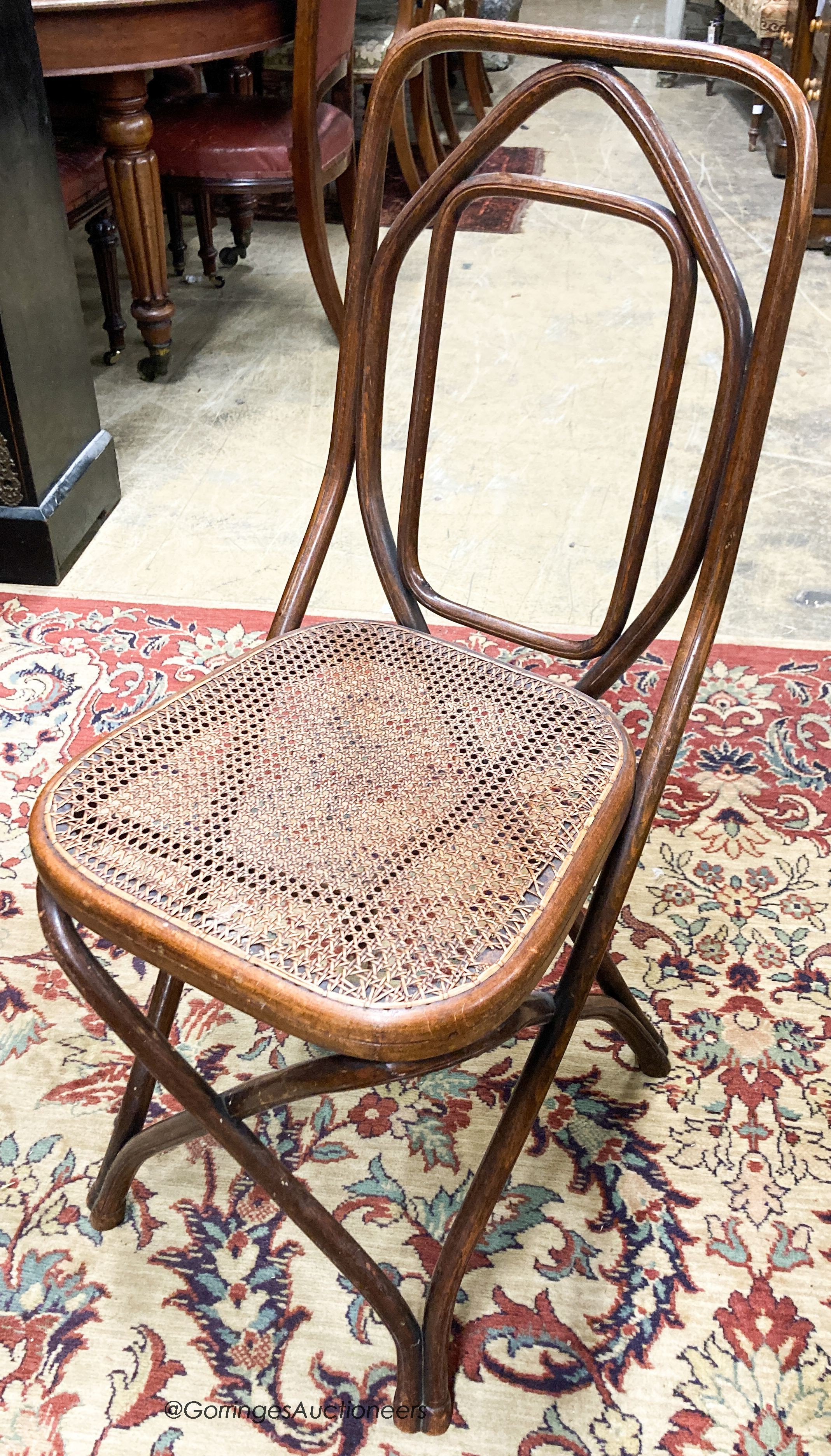 A set of five Thonet style caned beech bentwood chairs